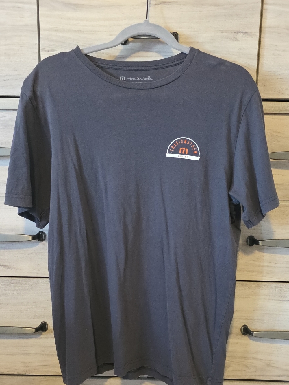 Travis Mathew Grey Short Sleeve Crew with Small Chest Graphic